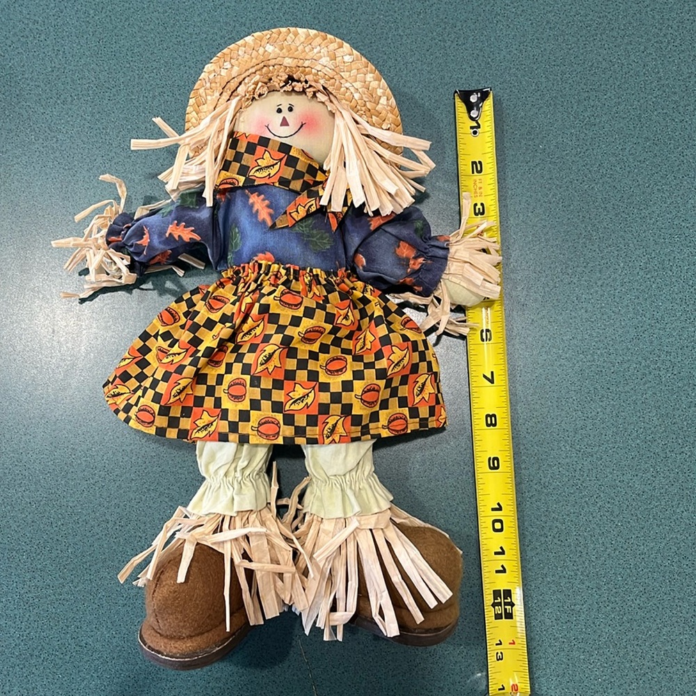 Scarecrow, sitting, approx 12” length, fall/ harvest decor.